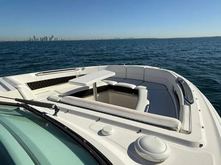  Yacht Photos Pics 2019 Sea Ray SLX 310 boat with spacious seating, cruising on open water.