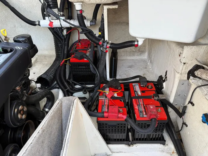  Yacht Photos Pics Engine compartment of 2019 Sea Ray SLX 310 with visible batteries and wiring.