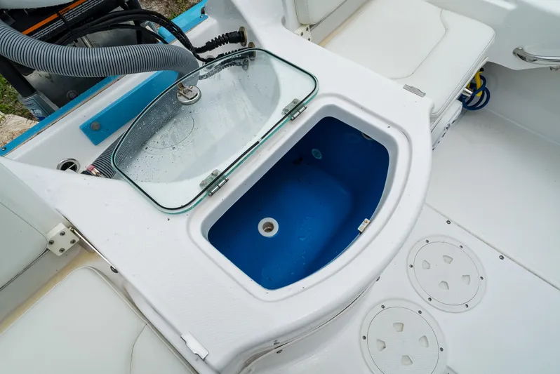  Yacht Photos Pics 2021 Everglades 243 Center Console boat with open livewell and seating area.