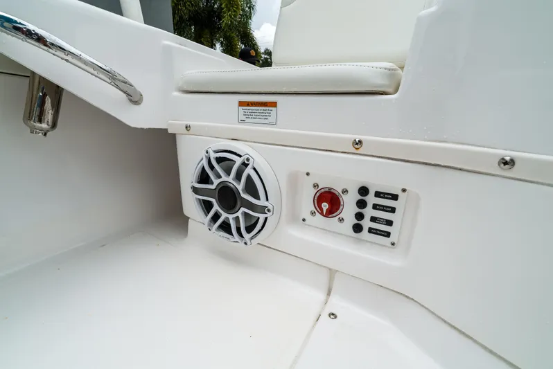  Yacht Photos Pics 2021 Everglades 243 Center Console boat interior with speaker and control panel.
