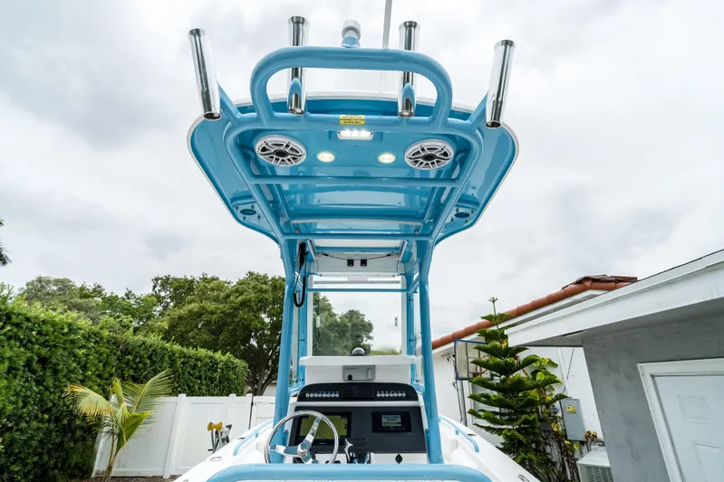  Yacht Photos Pics 2021 Everglades 243 Center Console boat with blue T-top and speakers.
