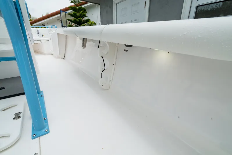  Yacht Photos Pics 2021 Everglades 243 Center Console boat interior with white deck and blue accents.