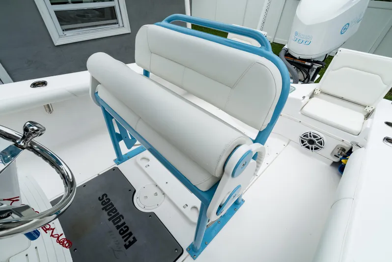 Yacht Photos Pics 2021 Everglades 243 Center Console boat with white and blue seating.
