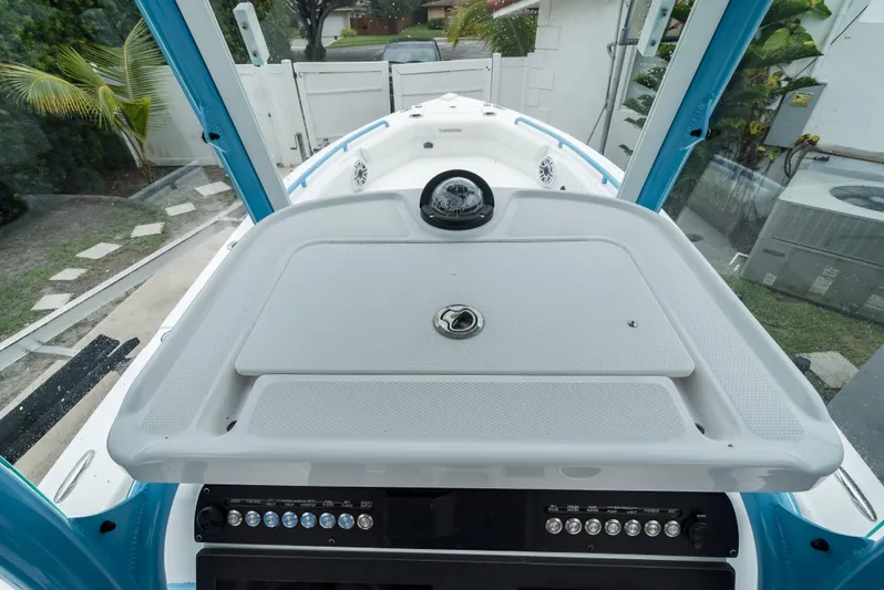  Yacht Photos Pics 2021 Everglades 243 Center Console boat interior with control panel and deck view.