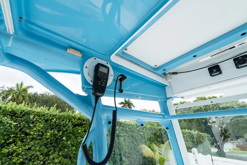  Yacht Photos Pics Interior view of 2021 Everglades 243 Center Console boat with blue ceiling and radio equipment.