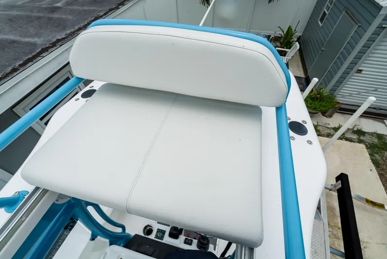  Yacht Photos Pics 2021 Everglades 243 Center Console boat seat with white and blue accents.