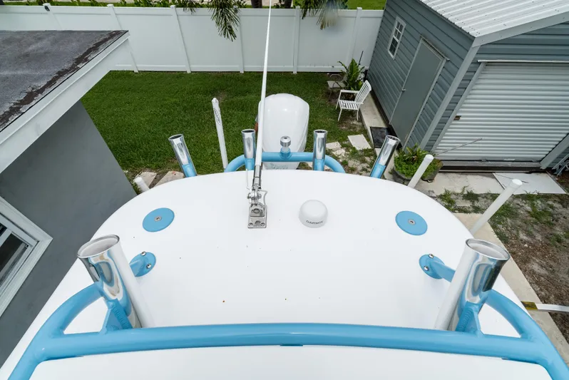  Yacht Photos Pics 2021 Everglades 243 Center Console boat, top view, in a backyard setting.