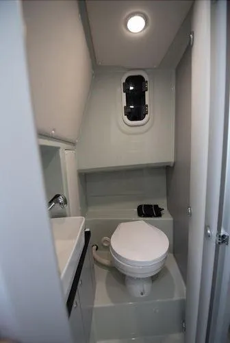  Yacht Photos Pics 2024 XO Boats DFNDR 9 bathroom interior with modern fixtures and compact design.