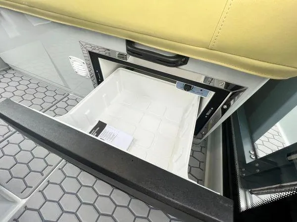  Yacht Photos Pics 2024 XO Boats DFNDR 9 interior with open storage compartment and hexagonal floor design.