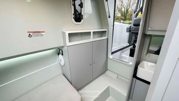  Yacht Photos Pics 2024 XO Boats DFNDR 9 interior with modern cabinetry and seating area.