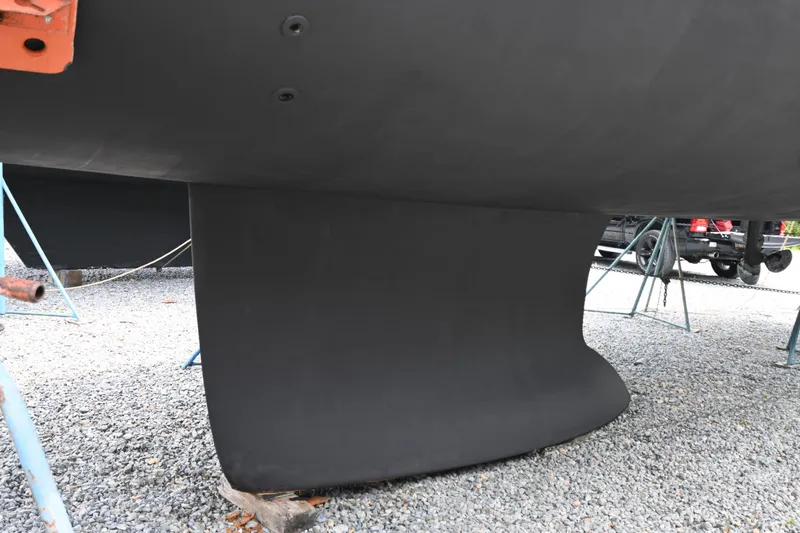 Liberty Yacht Photos Pics 2011 Beneteau Oceanis 50 sailboat keel on gravel, supported by stands.