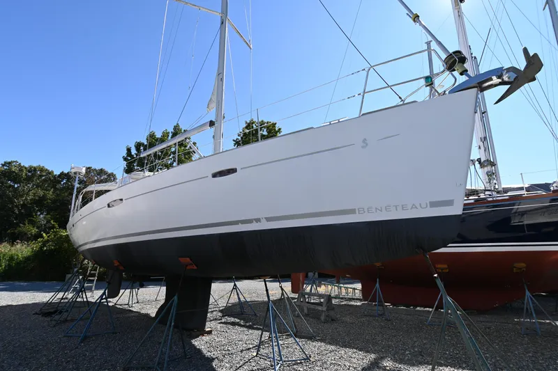 Liberty Yacht Photos Pics 2011 Beneteau Oceanis 50 sailboat on stands, side view, clear sky background.