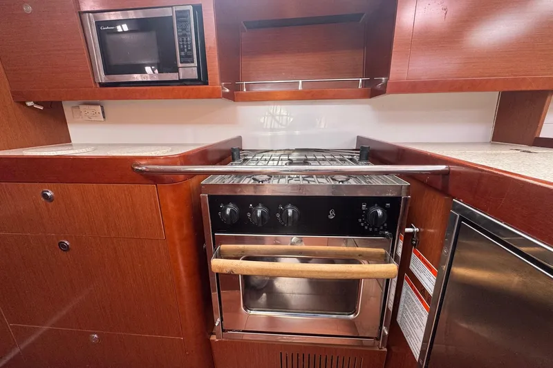 Liberty Yacht Photos Pics Galley kitchen in 2011 Beneteau Oceanis 50 yacht with stove and microwave.