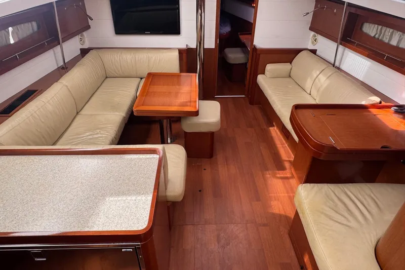 Liberty Yacht Photos Pics Luxurious interior of 2011 Beneteau Oceanis 50 yacht with leather seating and wooden finishes.