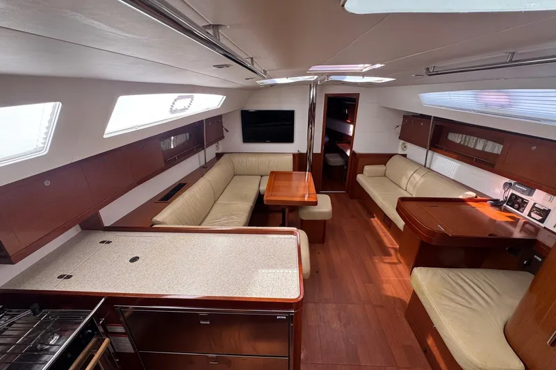 Liberty Yacht Photos Pics Luxurious interior of 2011 Beneteau Oceanis 50 yacht with elegant wood finish and seating.