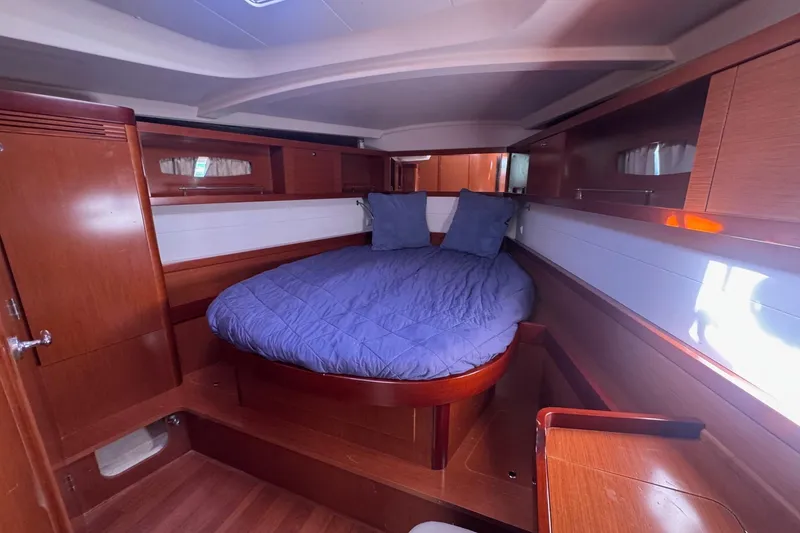 Liberty Yacht Photos Pics Luxurious cabin interior of 2011 Beneteau Oceanis 50 sailboat with cozy bedding.