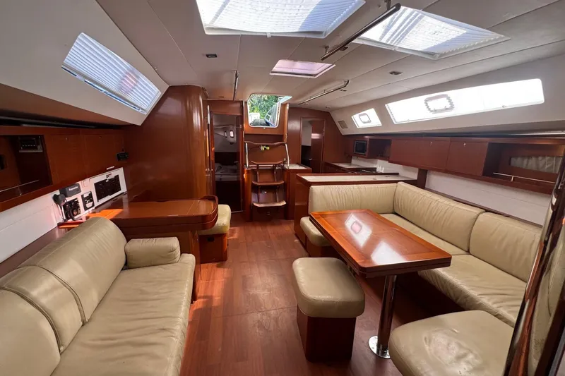 Liberty Yacht Photos Pics Luxurious interior of 2011 Beneteau Oceanis 50 yacht with spacious seating and wooden finishes.