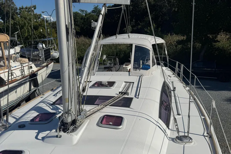 Liberty Yacht Photos Pics 2011 Beneteau Oceanis 50 sailboat with white deck and visible rigging, docked outdoors.