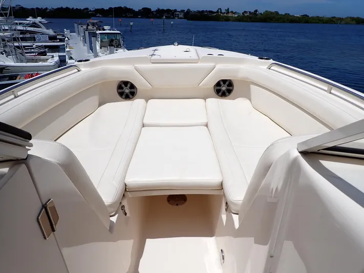  Yacht Photos Pics 2019 Grady-White Freedom 275 boat interior with white cushioned seating.