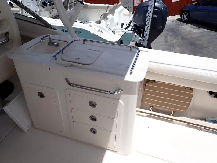  Yacht Photos Pics 2019 Grady-White Freedom 275 boat interior with sink and storage drawers.