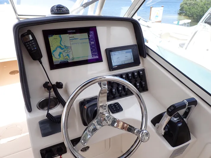 Yacht Photos Pics 2019 Grady-White Freedom 275 helm with navigation system and controls.