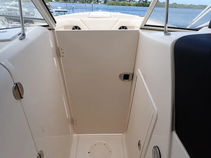  Yacht Photos Pics 2019 Grady-White Freedom 275 boat interior with closed cabin door.