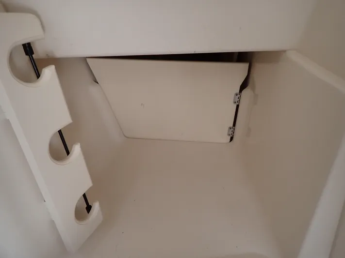  Yacht Photos Pics 2019 Grady-White Freedom 275 storage compartment with rod holders.