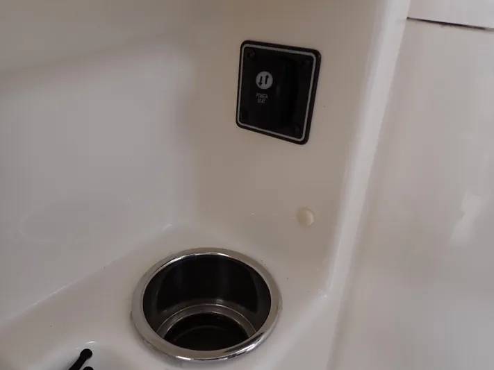  Yacht Photos Pics 2019 Grady-White Freedom 275 boat interior detail with cup holder and power outlet.