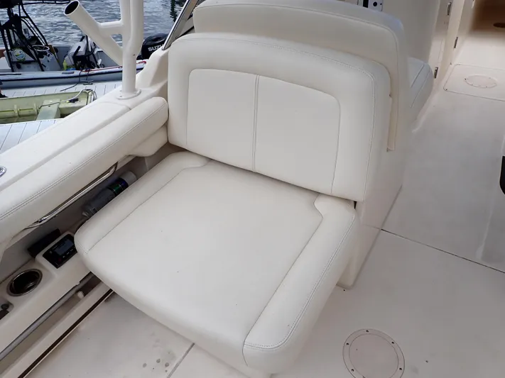  Yacht Photos Pics 2019 Grady-White Freedom 275 boat interior seating with white upholstery.