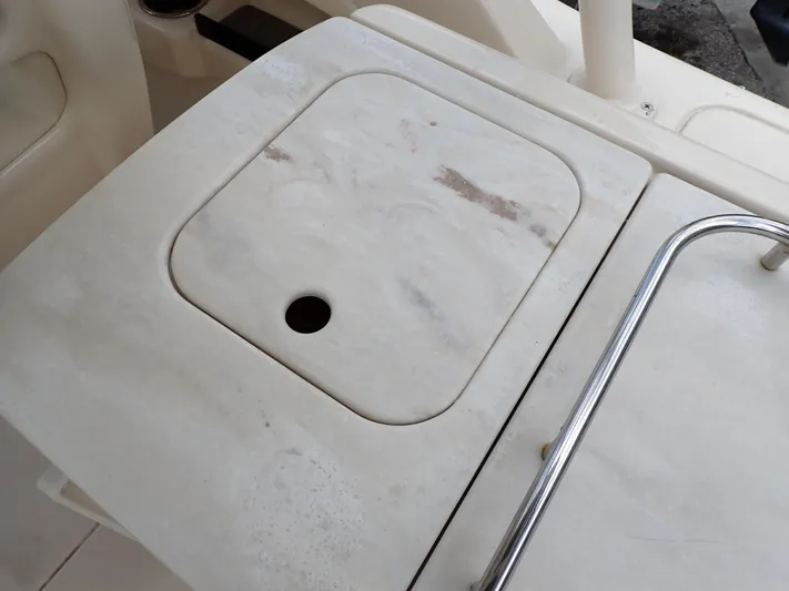  Yacht Photos Pics 2019 Grady-White Freedom 275 boat deck with storage compartment.