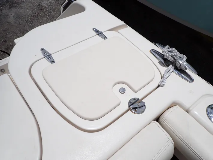  Yacht Photos Pics 2019 Grady-White Freedom 275 boat deck with storage compartment and rope.