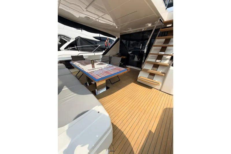  Yacht Photos Pics Luxurious 2020 Ferretti Yachts 720 deck with seating and stairs, showcasing elegance and style.