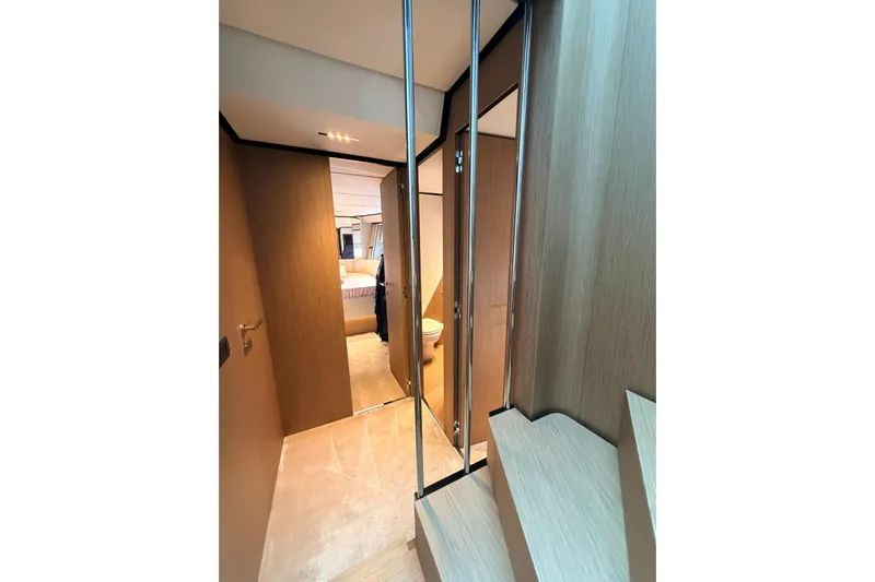  Yacht Photos Pics Interior hallway of 2020 Ferretti Yachts 720, featuring modern wood finishes.
