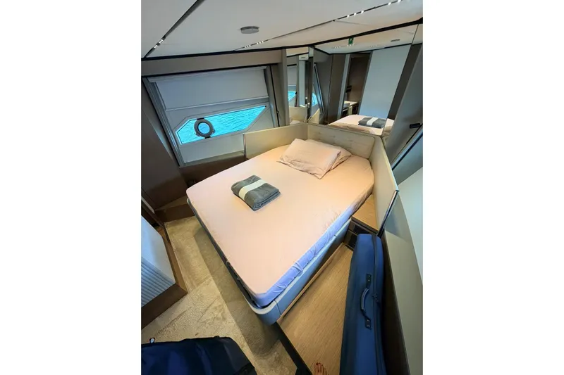  Yacht Photos Pics Luxurious bedroom interior of 2020 Ferretti Yachts 720 with modern design and ocean view.