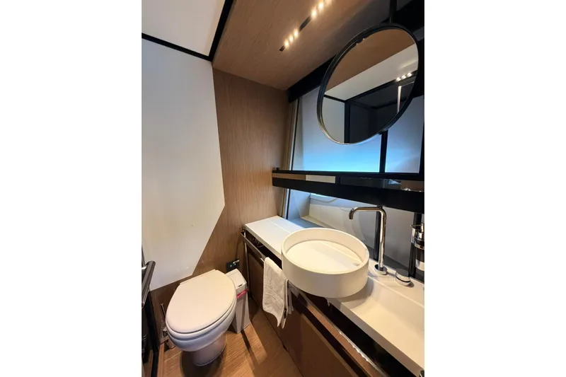  Yacht Photos Pics Luxurious bathroom in 2020 Ferretti Yachts 720, featuring modern fixtures and elegant design.