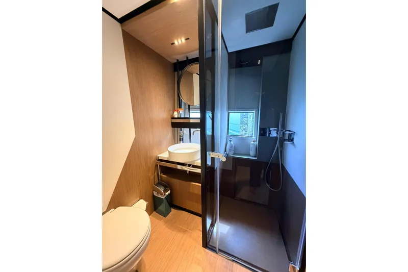  Yacht Photos Pics Luxurious bathroom in 2020 Ferretti Yachts 720, featuring modern fixtures and elegant design.