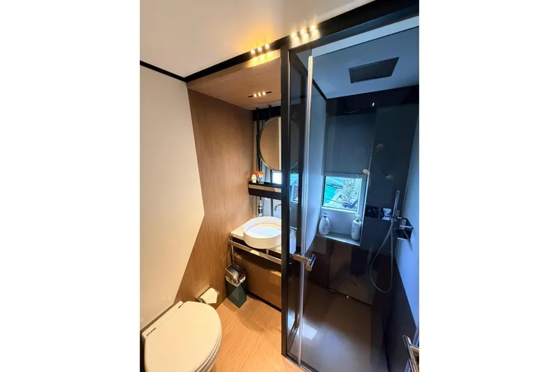  Yacht Photos Pics Luxurious bathroom in a 2020 Ferretti Yachts 720, featuring modern fixtures and elegant design.