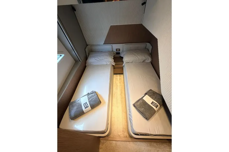  Yacht Photos Pics Twin beds in a 2020 Ferretti Yachts 720 cabin, featuring modern design and comfort.