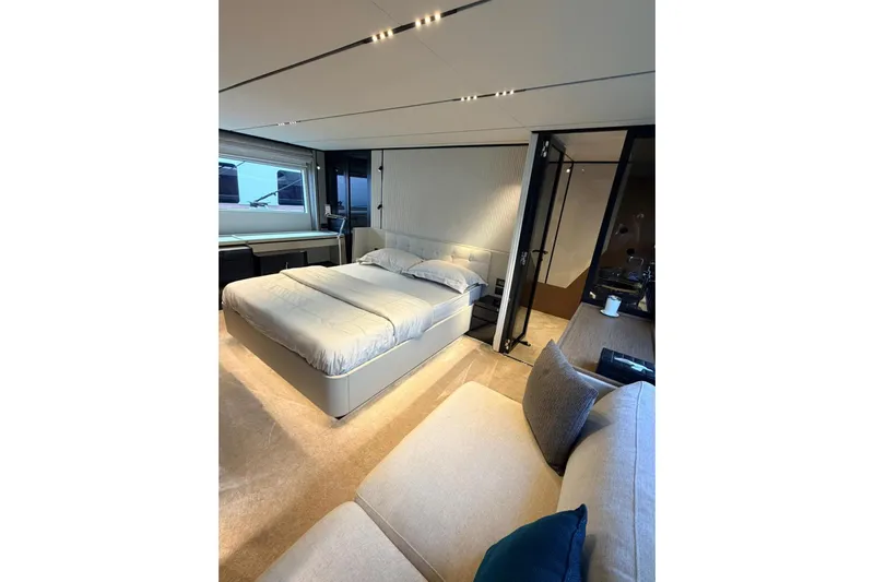  Yacht Photos Pics Luxurious bedroom interior of 2020 Ferretti Yachts 720, featuring modern design and elegant furnishings.