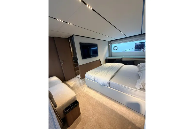  Yacht Photos Pics Luxurious bedroom interior of 2020 Ferretti Yachts 720 with modern design and elegant furnishings.