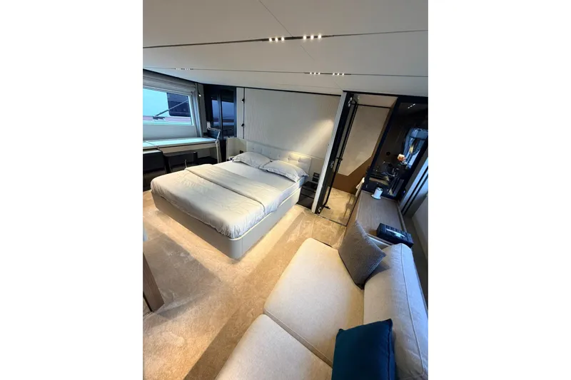  Yacht Photos Pics Luxurious bedroom interior of 2020 Ferretti Yachts 720 with modern design and elegant furnishings.