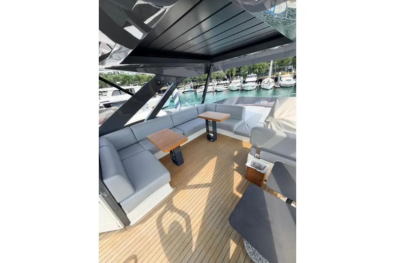 Yacht Photos Pics Luxurious 2020 Ferretti Yachts 720 deck with elegant seating and wooden flooring.