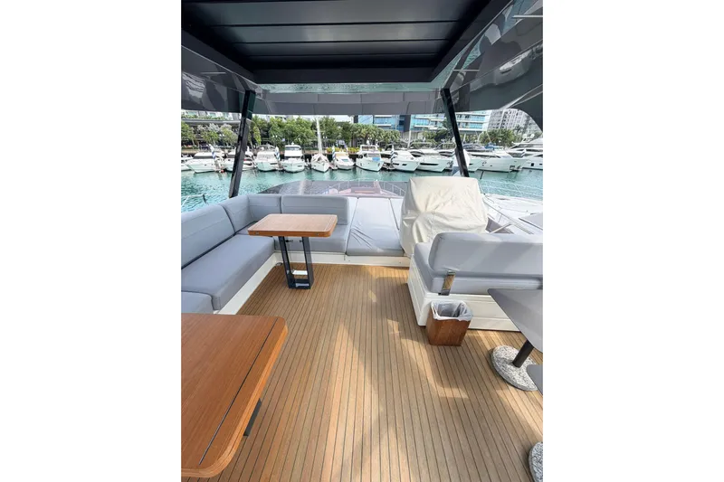  Yacht Photos Pics Luxurious 2020 Ferretti Yachts 720 interior with elegant seating and wooden flooring.