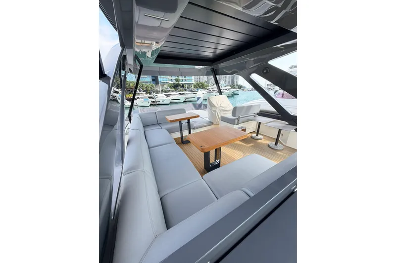  Yacht Photos Pics Luxurious seating area on a 2020 Ferretti Yachts 720, docked at a marina.
