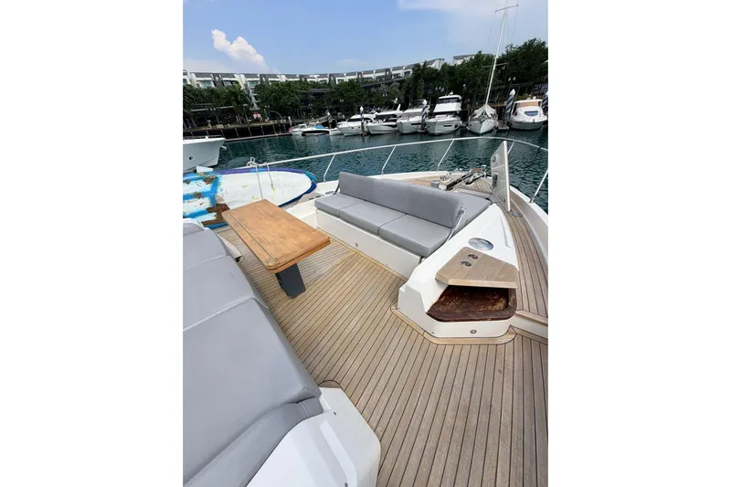  Yacht Photos Pics Luxurious 2020 Ferretti Yachts 720 with elegant deck seating and wooden table, docked at marina.
