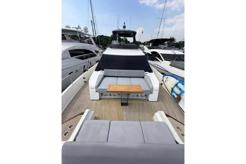  Yacht Photos Pics 2020 Ferretti Yachts 720, luxury yacht deck with seating and table, docked at marina.