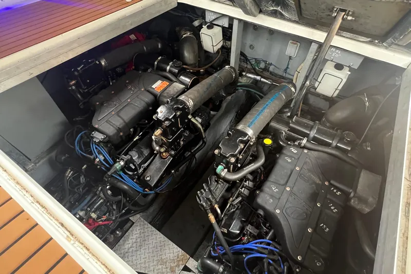 Priorities Yacht Photos Pics Engine compartment of a 1999 Sea Ray 380 Sundancer boat, showcasing dual engines.