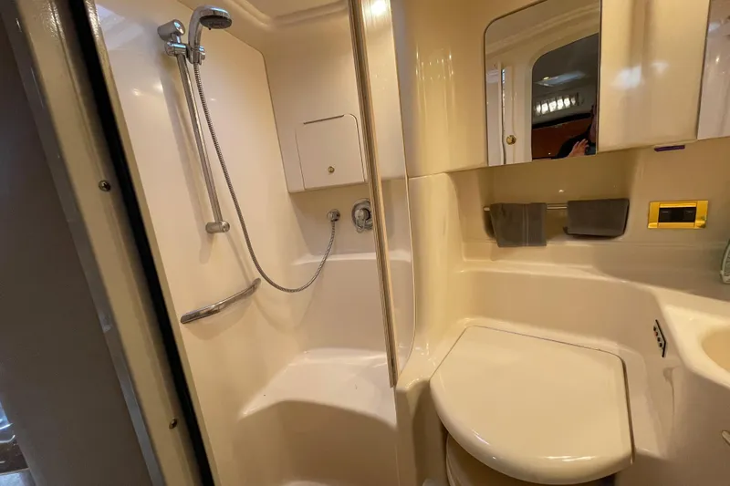Priorities Yacht Photos Pics Bathroom interior of 1999 Sea Ray 380 Sundancer yacht with shower and toilet.