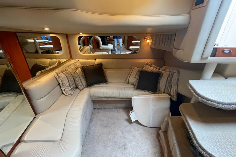 Priorities Yacht Photos Pics Luxurious interior of 1999 Sea Ray 380 Sundancer yacht with plush seating and elegant decor.