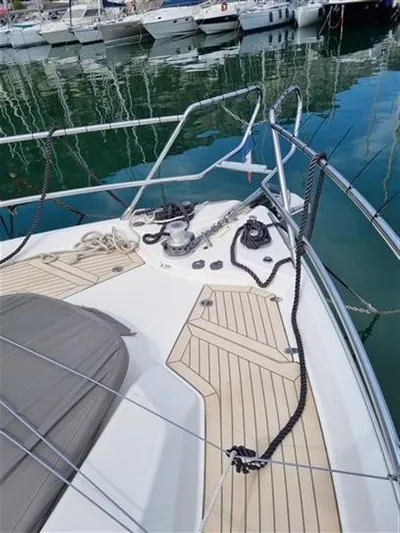 Yacht Photos Pics 2019 Cranchi 60HT yacht deck with ropes and winch in marina.